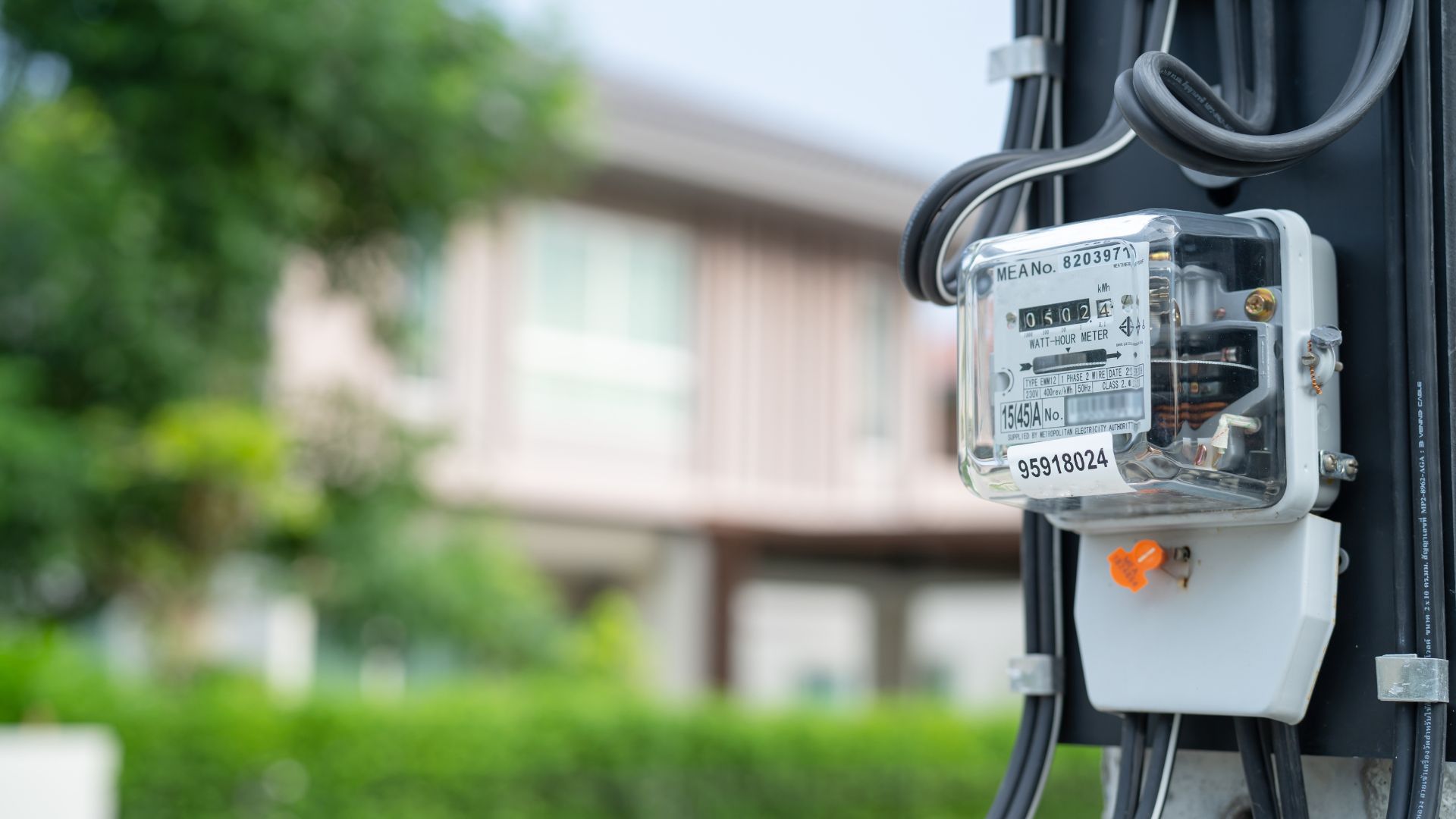 A close up of an electrical device attached to a pole